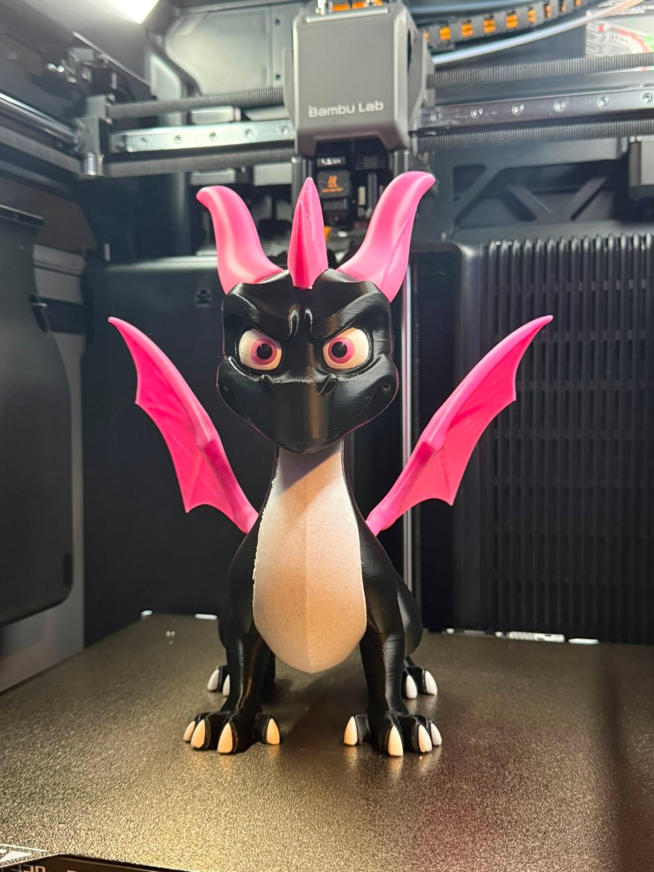 Client photo index 7: straight-on front view of the same dragon centred on the build plate, looking into the, the enclosure